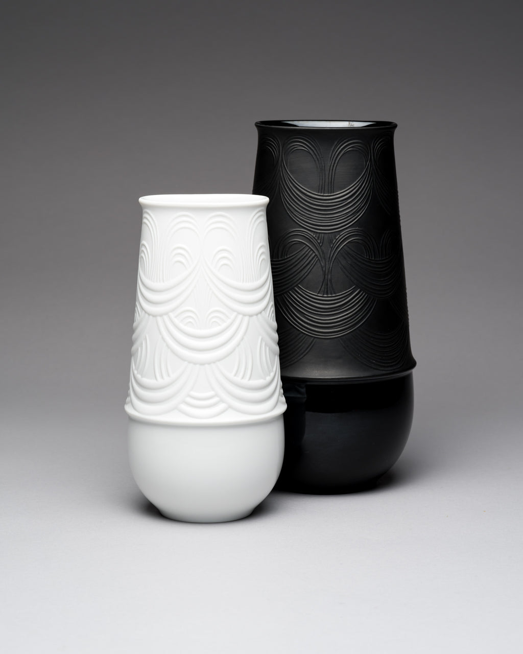 White and black textured Rosenthal vases on a gray background by Bjorn Wiinblad