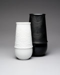 White and black textured Rosenthal vases on a gray background by Bjorn Wiinblad