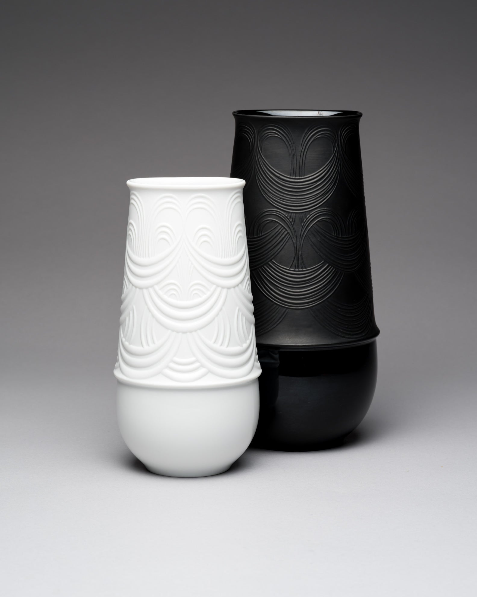 White and black textured Rosenthal vases on a gray background by Bjorn Wiinblad