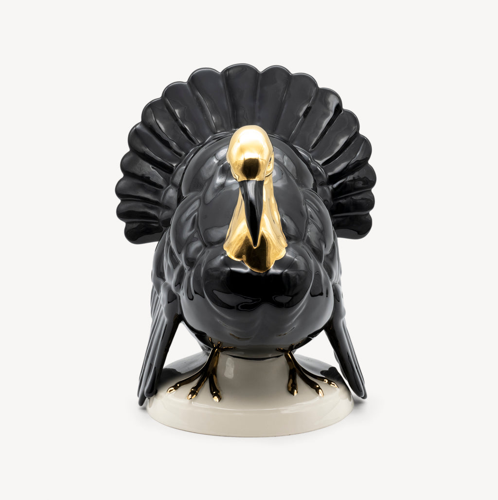 Front view of a black and gold Goebel porcelain turkey sculpture with a broad fan-shaped tail.